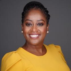 Headshot of Erika Robinson wearing a yellow top